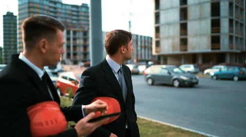 Two architect customers discuss their project with Tablet PC Stock Footage 67572288