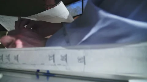 Two architects are working on the project documentation. Unusual camera Stock Footage 180554771