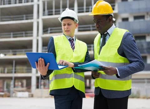 Two architects discussing construction project Stock Photos