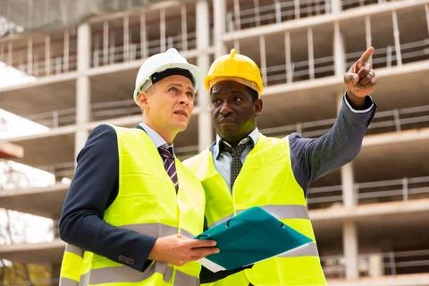 Two architects discussing construction project Stock Photos
