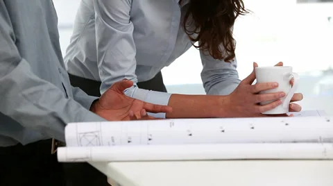 Two architects examining a plan Видео 977816