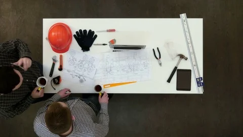 Two architects having phone call during coffee break Vídeos de archivo 71620417