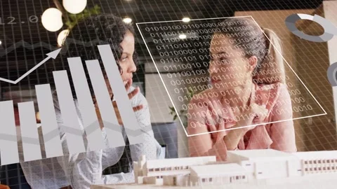Two architects leaning over model, pointing, activating overlay charts over Stock Footage 333368226