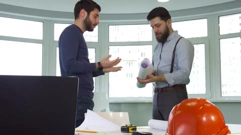 Two architects shake hands at the office Stock Footage 311944853