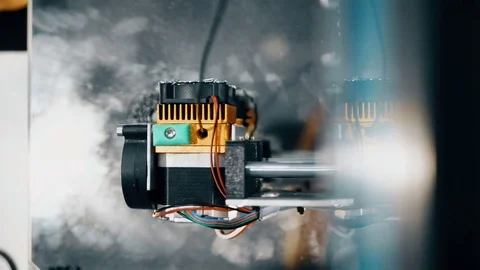 Two architects working in office creating models for project using 3D printer Stock Footage 82546395