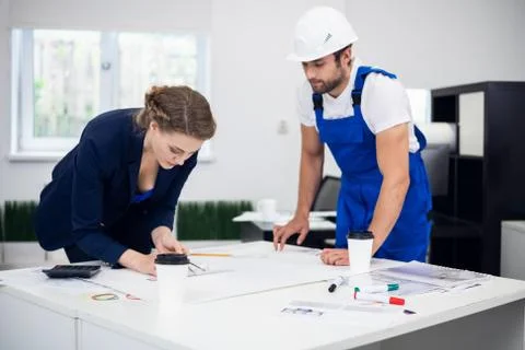 Two architects working on a project in the office Stock Photos
