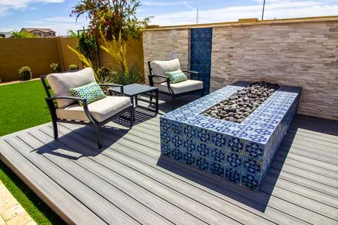 Two Arm Chairs And Table By Ceramic Tile Fire Pit Stock Photos