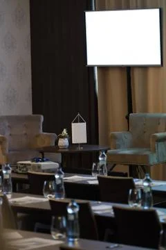 Two armchairs be speaker table in luxury conference room before seminar. Big Stock Photos