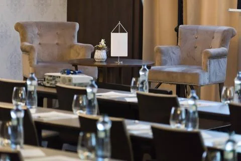 Two armchairs be speaker table in luxury conference room before seminar. 스톡 사진