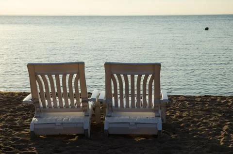 Two armchairs at beach Stock Photos