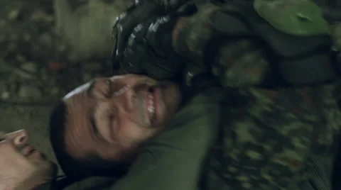 Two armed men in military uniforms entered the melee in the big hall of an Stock-Footage 67172028