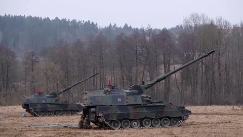 Two artillery mounts shoot in the field. NATO exercises Video stock 121796257