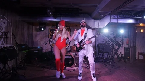 Two artists are singing and playing guitar on the stage in a club Stock-Footage 103665599