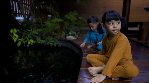 Two asian 3-4 years old kids quarantine stay home good time smiling Stock Footage 128942897