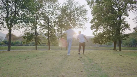 Two asian close friend cheerfully playing together at summer green park Stock Footage 149485716