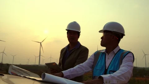 The two Asian engineers are checking the system for wind turbines Stock Footage 105466596