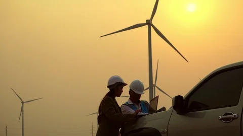 The two Asian engineers are checking the system for wind turbines Stock Footage 105467664