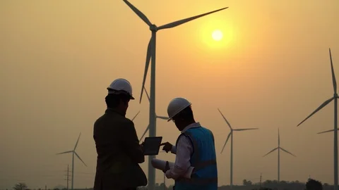 The two Asian engineers are checking the system for wind turbines Stock Footage 105473738