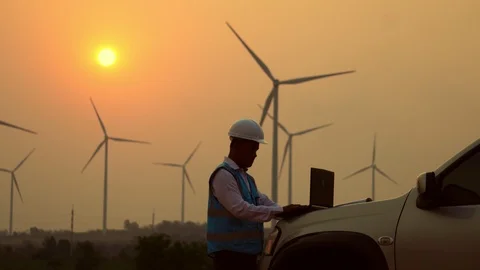 The two Asian engineers are checking the system for wind turbines Stock Footage 105475432