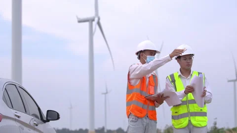 Two Asian engineers or technician men in uniform discuss  and checking. Stock Footage 168167301