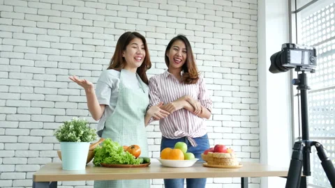 Two Asian influencer vlogger live review healthy lifestyle together. Stock Footage 266956982
