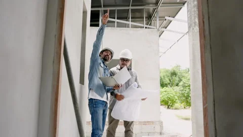 Two Asian men engineers construction supervisors workers  architects design.. Stock Footage 262709689