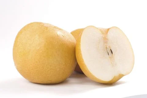 Two Asian pears on a white background, one whole and one sliced, showcasing 스톡 사진