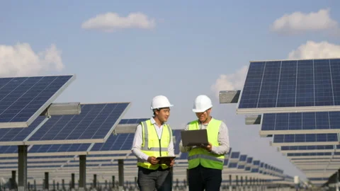 Two Asian Technician and Engineer man use laptop computer while check efficiency Stock Footage 197936989