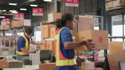 Two asian warehouse worker working checking package products in warehouse, lo Video stock 219259702