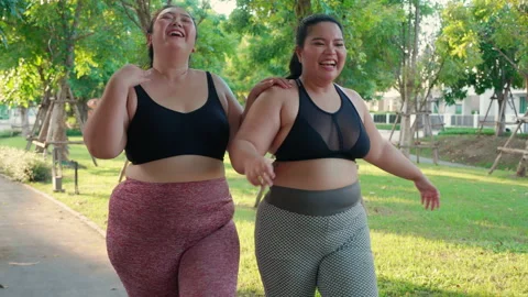 The obese woman in bra is trying top fit, Stock Video
