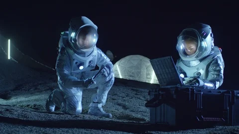 Two Astronauts Collect Rock and Soil Samples on the Alien Planet. Space Travel. Stock Footage 86082251