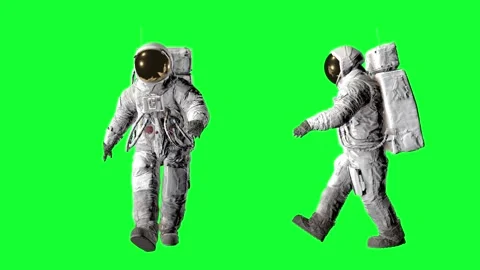 Two astronauts in full spacesuits with life support backpacks walking against 動画素材 316773210