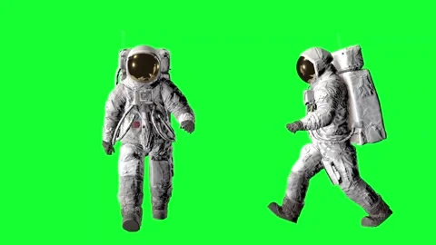 Two astronauts in full spacesuits with life support backpacks walking against 動画素材 316773262