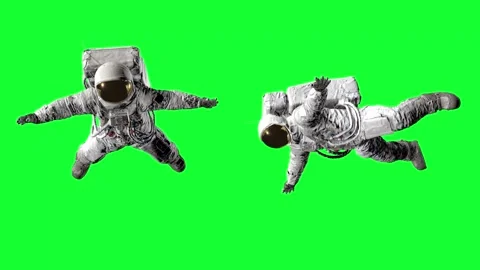 Two astronauts in full spacesuits with life support backpacks floating against Stock Footage 316773704