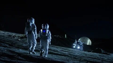 Two Astronauts in Space Suits Walk on the Alien Planet Looking at the Sky.  Stock Footage 86080254