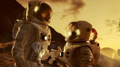 Two Astronauts Talking while Exploring Mars/ Red Planet. Space Exploration Stock Photos