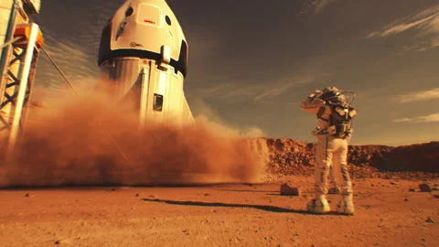 Two astronauts watch spacecraft landing on Mars surface Stock Footage 247089222