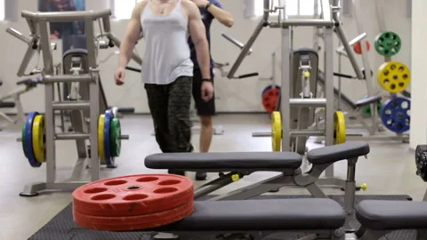 Two athletes in the gym are preparing for training Stock Footage 107324225