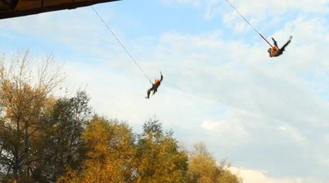 Two athletes jumping off the bridge at the same time Stock Footage 34363595