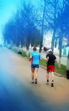 Two athletes running Stock Photos