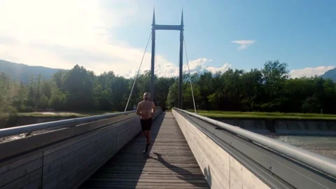 Two athletes train running on the wooden deck. Stock Footage 133608842