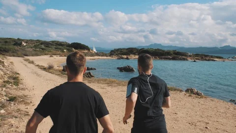 Two Athletic Men Running on the Beach 1 Vidéo 97259113