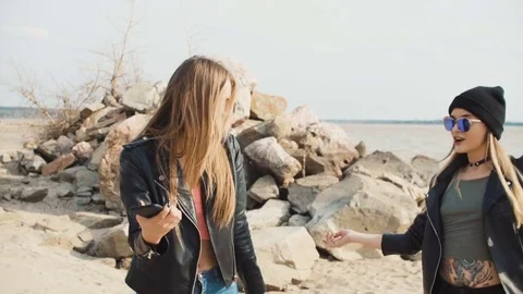 Two attractive blondes come off on the b... | Stock Video | Pond5