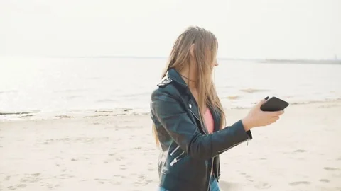 Two attractive blondes having fun near the water close-up slow motion Stock Footage 75693142