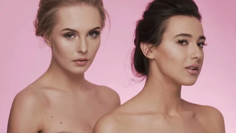 Two attractive girls at studio background Stock Footage 92706334
