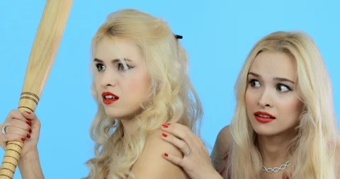 Two attractive purposeful persistent girls beat the burglar with a bat Video stock 122249735