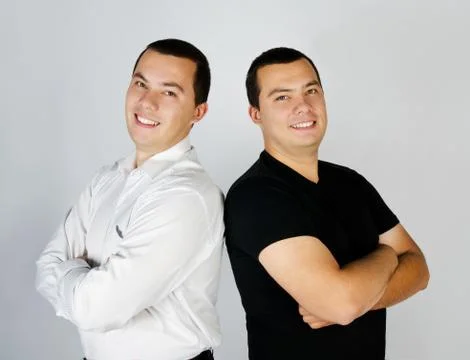 Two attractive smile young men twins Stock Photos
