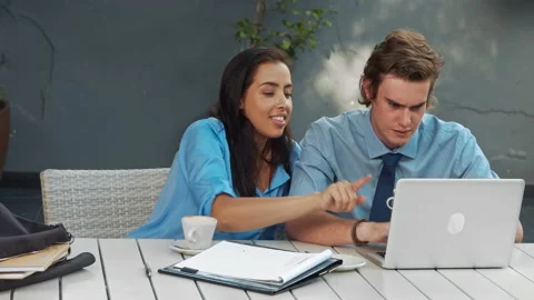 Two attractive young and exited professionals, brainstorming there ideas with a Stock-Footage 199634636