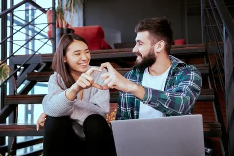Two attractive young office workers, together they formed a heart Stock Photos