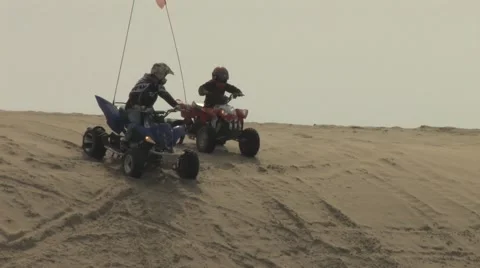 Two ATV's comming down Steep Sand Dune Stock-Footage 5071470